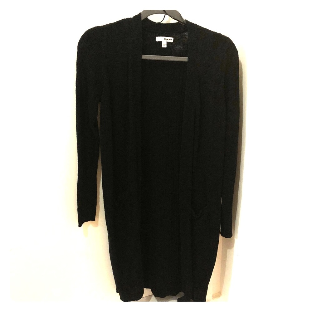 Black, knee-length knit sweater. Loose, light
